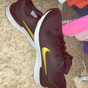 Women’s Black and Gold Nike react Size 9